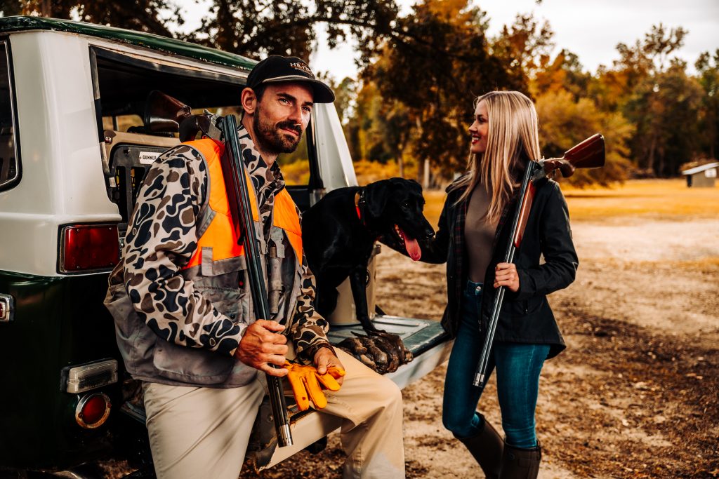 Guy and girl hunting with dog