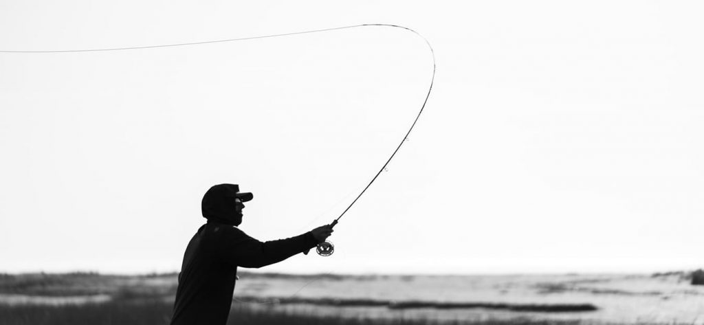 Man throwing fishing line.