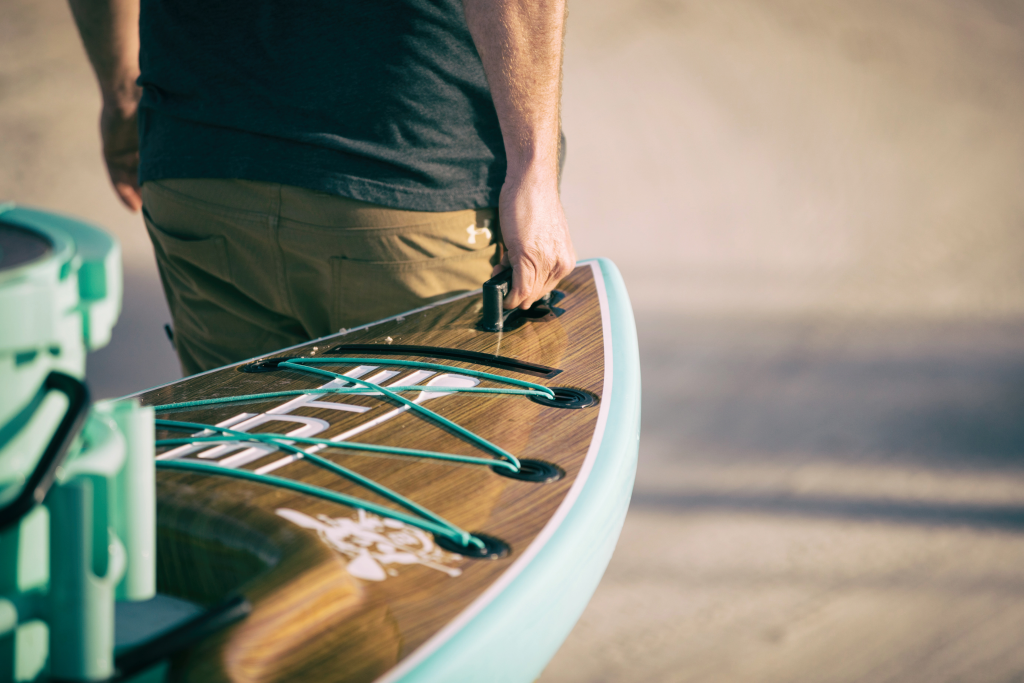 Guy carrying bote paddleboard