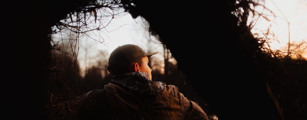 Back shot of person looking into the woods