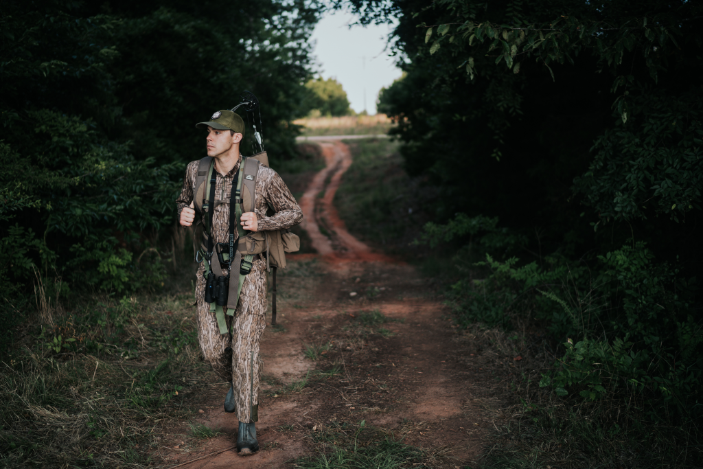 guy wearing camo walking down path