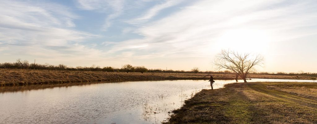Person fishing in a river