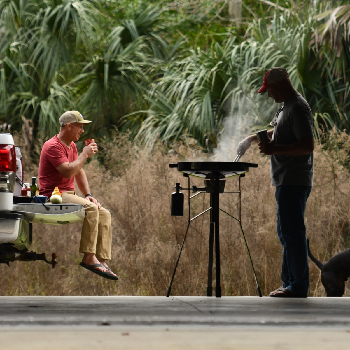 Man cooking and man watching