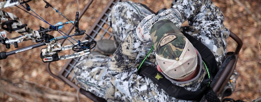 Aerial shot of man in tree perch.