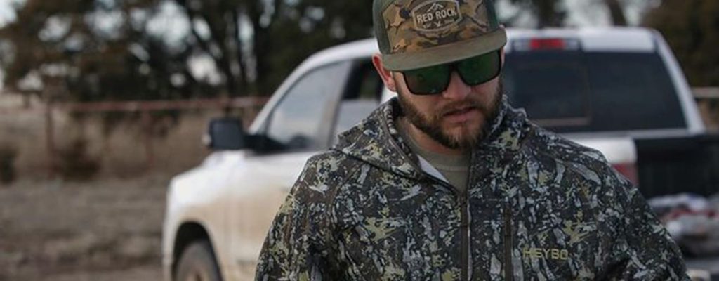 Man in camo in front of his truck