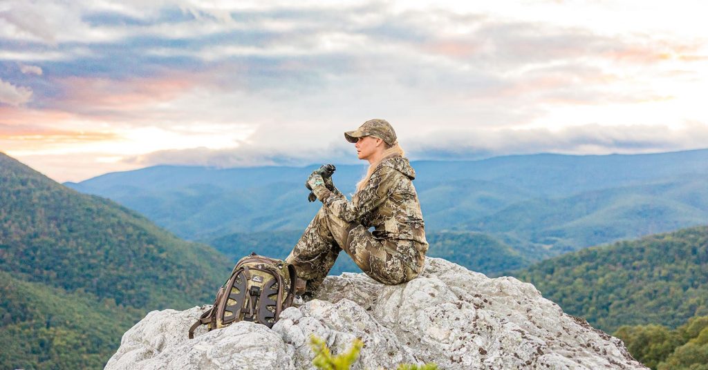 girl sitting on mountain