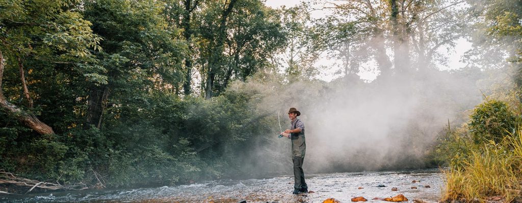Man fishing in a stream