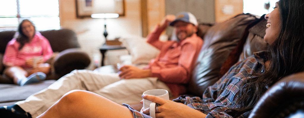 Group relaxing in living room