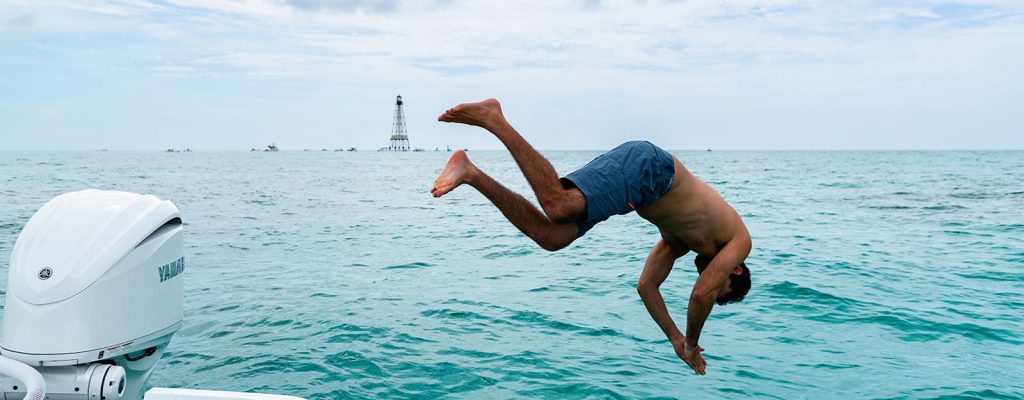 man jumping in water