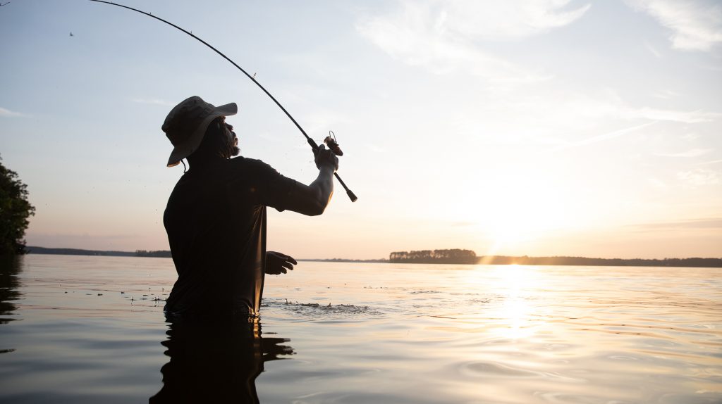Man casting fishing pole
