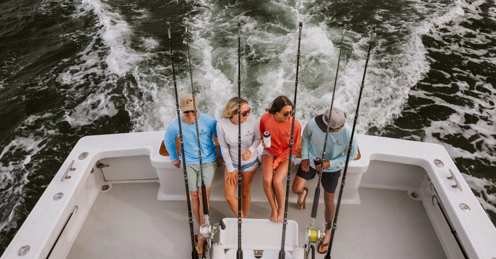 people on back of boat